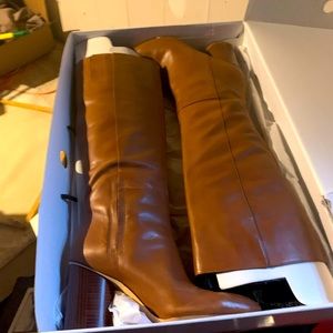 Tan tall booths, leather 4inch heel. Only worn twice. Pull up no zipper